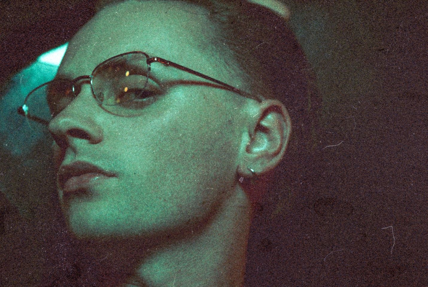 Artist Puma Blue wearing glasses and a silver earring